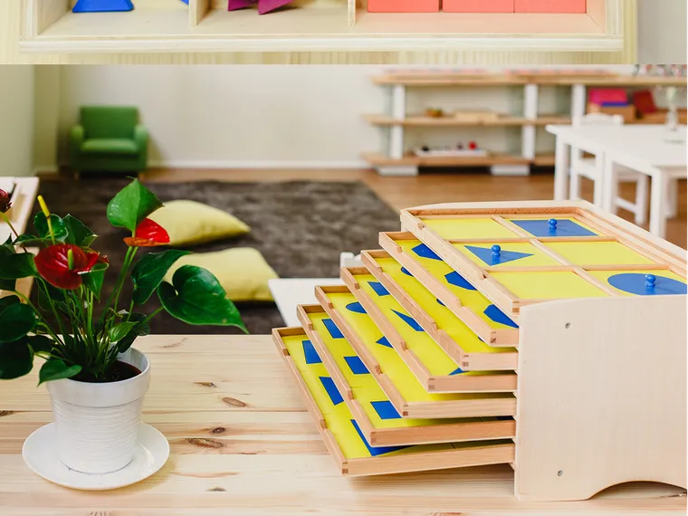 A stack of Southbridge curriculum books and Montessori materials